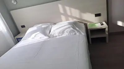 Letto o letti in una camera di DUCATO HOTEL e RESIDENCE