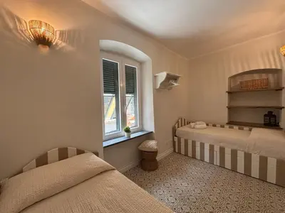 Letto o letti in una camera di HH Moneglia la Piazzetta