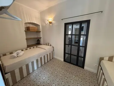Letto o letti in una camera di HH Moneglia la Piazzetta