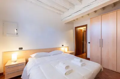 Letto o letti in una camera di GuestHost - Piazza San Bartolomeo Bright&Comfy Apt x4