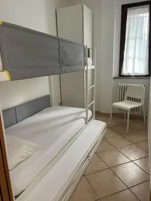 Letto o letti in una camera di HōM - Appartamento fino a 7 posti letto comodo al centro storico, al casello A1 e alla Stazione AV
