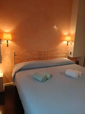 Letto o letti in una camera di inPARMA Ovest