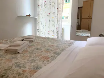 Letto o letti in una camera di Appartamentino via Garibaldi
