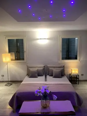 Letto o letti in una camera di La tua casa con giardino a 2 passi dal centro