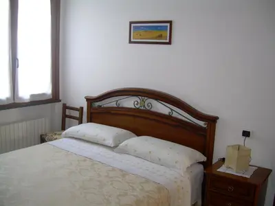 Letto o letti in una camera di Ariabuona