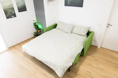 Letto o letti in una camera di Il Nido Verde Parcheggio Privato Cortile