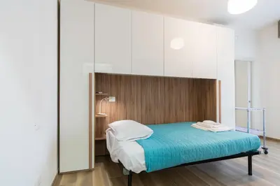 Letto o letti in una camera di La Nonantolana Apartment - Eden e Ocean