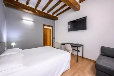 Letto o letti in una camera di Emilia Studios 3