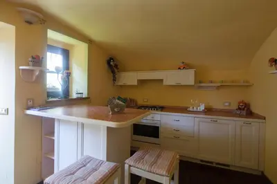 Cucina o angolo cottura di B&B La Pulce Dorata