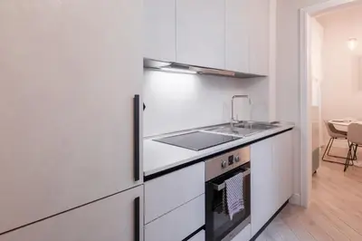 Cucina o angolo cottura di Molinari House Perla - Suite moderna in centro Modena - Free ZTL