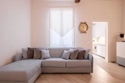 Area soggiorno di Molinari House Perla - Suite moderna in centro Modena - Free ZTL