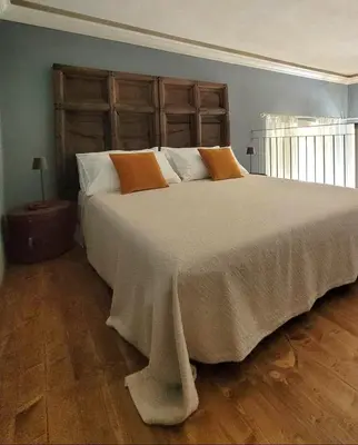 Letto o letti in una camera di Suite Dudley - Castello di Pallerone
