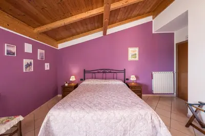 Letto o letti in una camera di Agriturismo Daniela