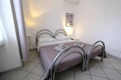 Letto o letti in una camera di Secret Garden by PortofinoVacanze