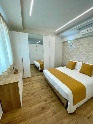 Letto o letti in una camera di VITA Residence