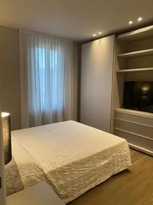 Letto o letti in una camera di La Bella Modena Giardini Appartamenti