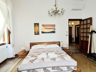 Letto o letti in una camera di La Bomboniera