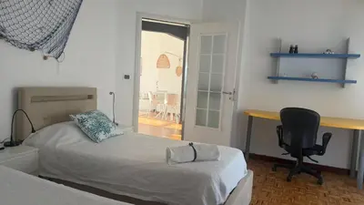Letto o letti in una camera di Attico con terrazza fronte mare a Cavi di Lavagna