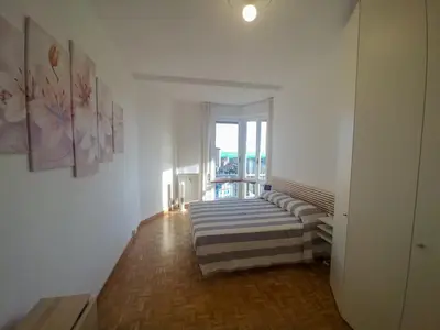Letto o letti in una camera di Super vista al grattacielo di Lavagna