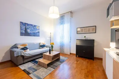 Letto o letti in una camera di GuestHost - Blu&Yellow Apartment in Parma Station