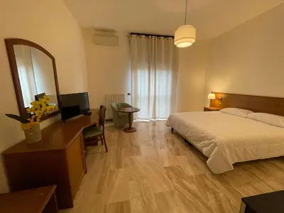 Letto o letti in una camera di Hotel Clementi