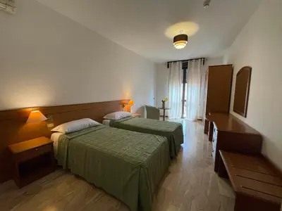 Letto o letti in una camera di Hotel Clementi