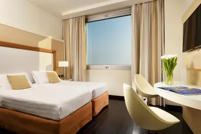 Letto o letti in una camera di Hotel La Favorita