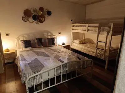 Letto o letti in una camera di La Torre Medievale - Storia e Comfort