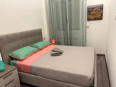 Letto o letti in una camera di WELCOME RIVIERA-MAZZINI 30- Bagno e arredamenti nuovi- Centralissimo a 100 m dalle spiaggie-Parcheggio a 15 euro al giorno, da prenotare