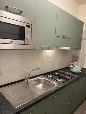 Cucina o angolo cottura di WELCOME RIVIERA-MAZZINI 30- Bagno e arredamenti nuovi- Centralissimo a 100 m dalle spiaggie-Parcheggio a 15 euro al giorno, da prenotare