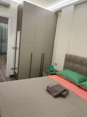 Letto o letti in una camera di WELCOME RIVIERA-MAZZINI 30- Bagno e arredamenti nuovi- Centralissimo a 100 m dalle spiaggie-Parcheggio a 15 euro al giorno, da prenotare