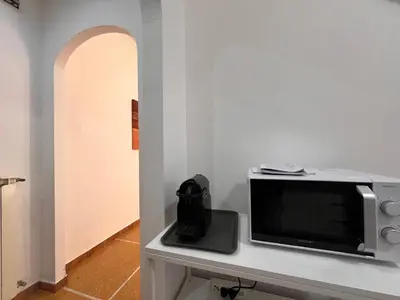 TV o dispositivi per l'intrattenimento presso JOIVY Inviting 1-bedroom flat with Balcony in Rapallo