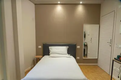 Letto o letti in una camera di Giardini Rooms