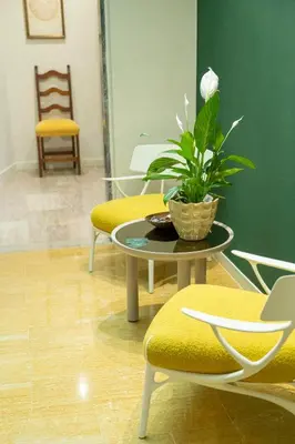 Area soggiorno di Giardini Rooms