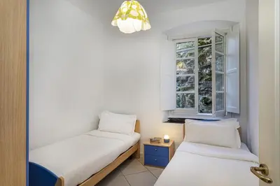 Letto o letti in una camera di La Veranda di Rapallo by Wonderful Italy
