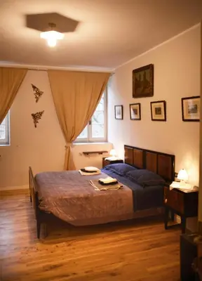 Letto o letti in una camera di PODERE PALAZZO ILLICA Agriturismo