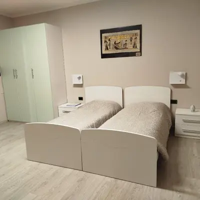 Letto o letti in una camera di Casa Rossy