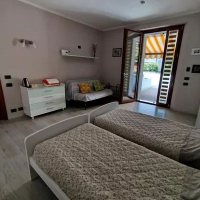 Letto o letti in una camera di Casa Rossy