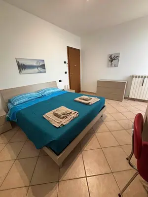 Letto o letti in una camera di B&B Canossa