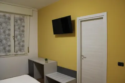 TV o dispositivi per l'intrattenimento presso Rooms primo piano