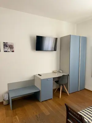 TV o dispositivi per l'intrattenimento presso Rooms primo piano