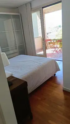 Letto o letti in una camera di Appartamento luminoso