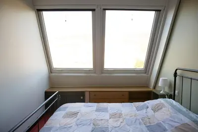 Letto o letti in una camera di Casa silenziosa Via Eraldo fico 100 Sestri levante