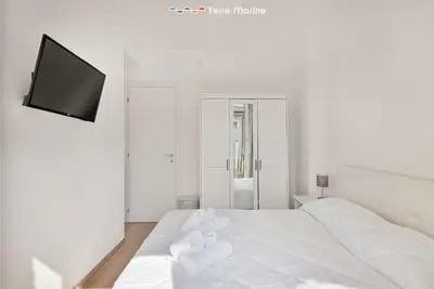 Letto o letti in una camera di Cherry, Terre Marine