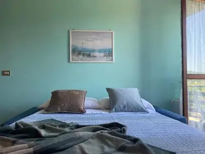 Letto o letti in una camera di Apartment in the greenery near the Cinque Terre