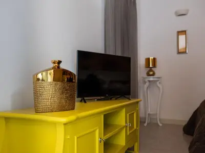 TV o dispositivi per l'intrattenimento presso Cattania Suites and Rooms