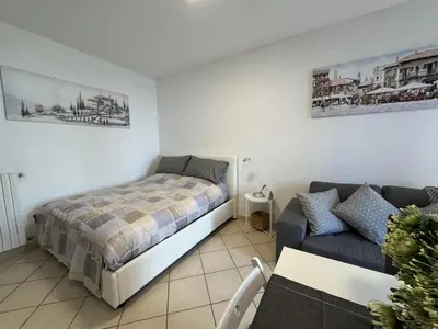 Letto o letti in una camera di Reggio Emilia Apartments - Giardino - Uno