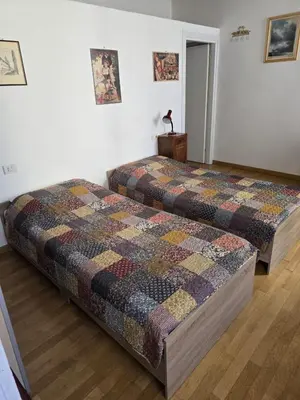 Letto o letti in una camera di GuestHost - Elegant & Bright Flat in Parma Center