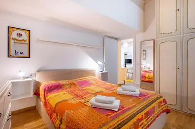 Letto o letti in una camera di GuestHost - Elegant & Bright Flat in Parma Center