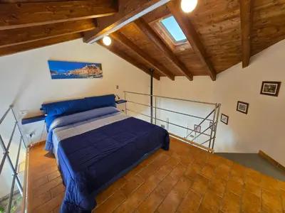 Letto o letti in una camera di Appartamento OM Ponente
